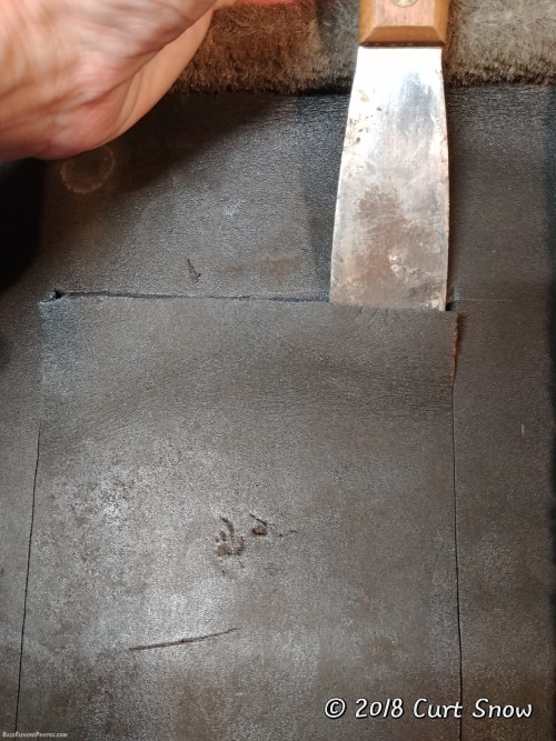 Using a flat blade to help peel the foam
