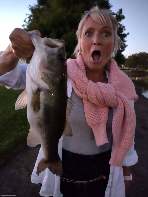 My wife goofing off after catching a nice bass from our neighborhood pond ?