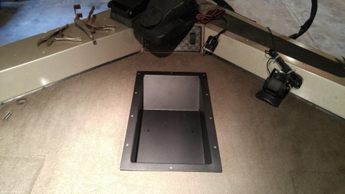 The new tray, dropped into the hole and screwed in place.